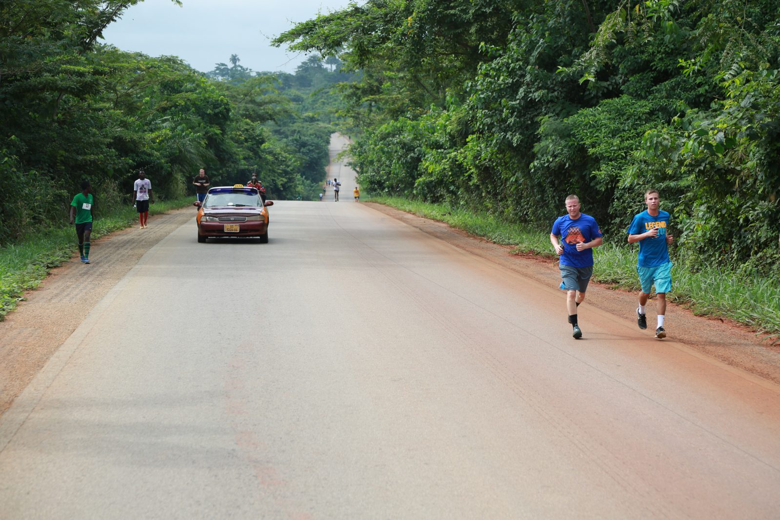 Runners strung out along the long road