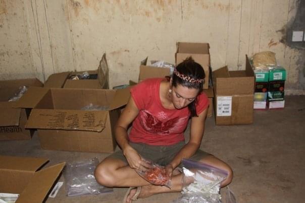 Volunteer sorting donated medical supplies