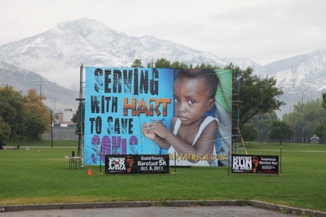 Volunteers gathered in front of the HART billboard